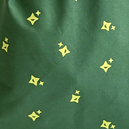 Close-up of cotton canvas featuring " MagicHolz" stars